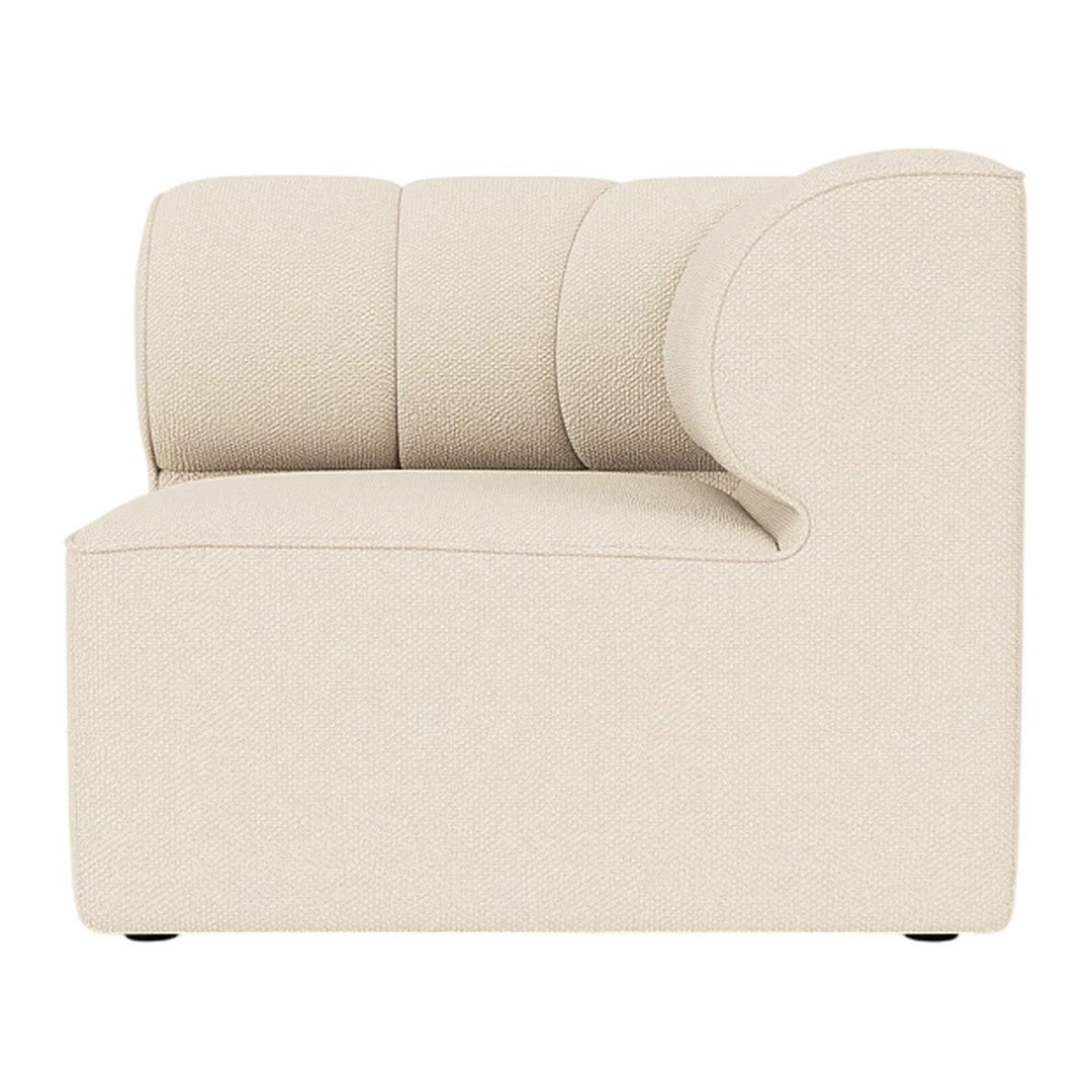 Beige curved accent chair with a modern, minimalist design and soft, smooth upholstery. Ideal for contemporary interiors.