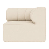 Beige curved accent chair with a modern, minimalist design and soft, smooth upholstery. Ideal for contemporary interiors.