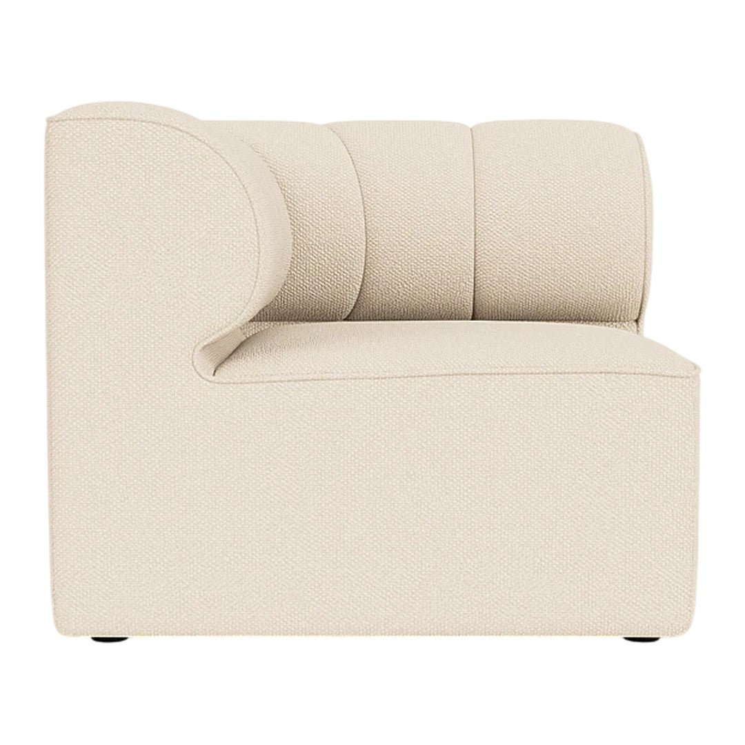 Beige upholstered sectional sofa with a curved arm and minimalist design. Soft texture and modern aesthetic.