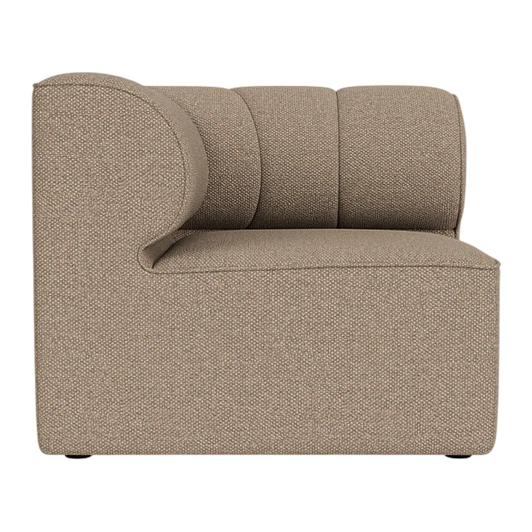 "Side view of a modern beige accent chair with a textured, minimalist design."