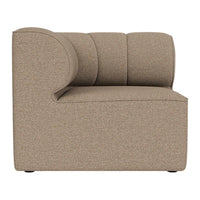 "Side view of a modern beige accent chair with a textured, minimalist design."
