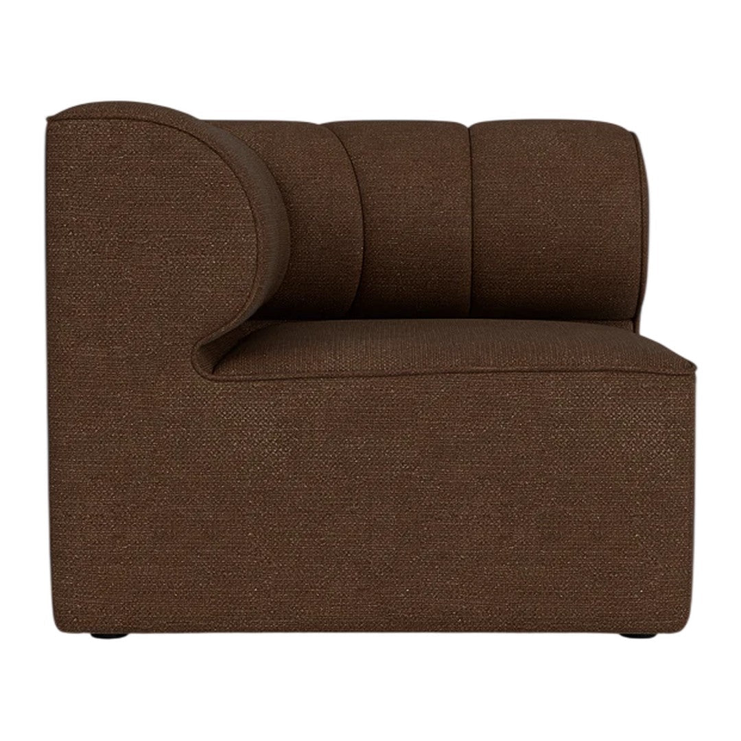 Brown upholstered corner chair with rounded arm and textured fabric pattern, ideal for modern interiors.