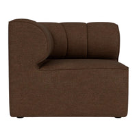Brown upholstered corner chair with rounded arm and textured fabric pattern, ideal for modern interiors.