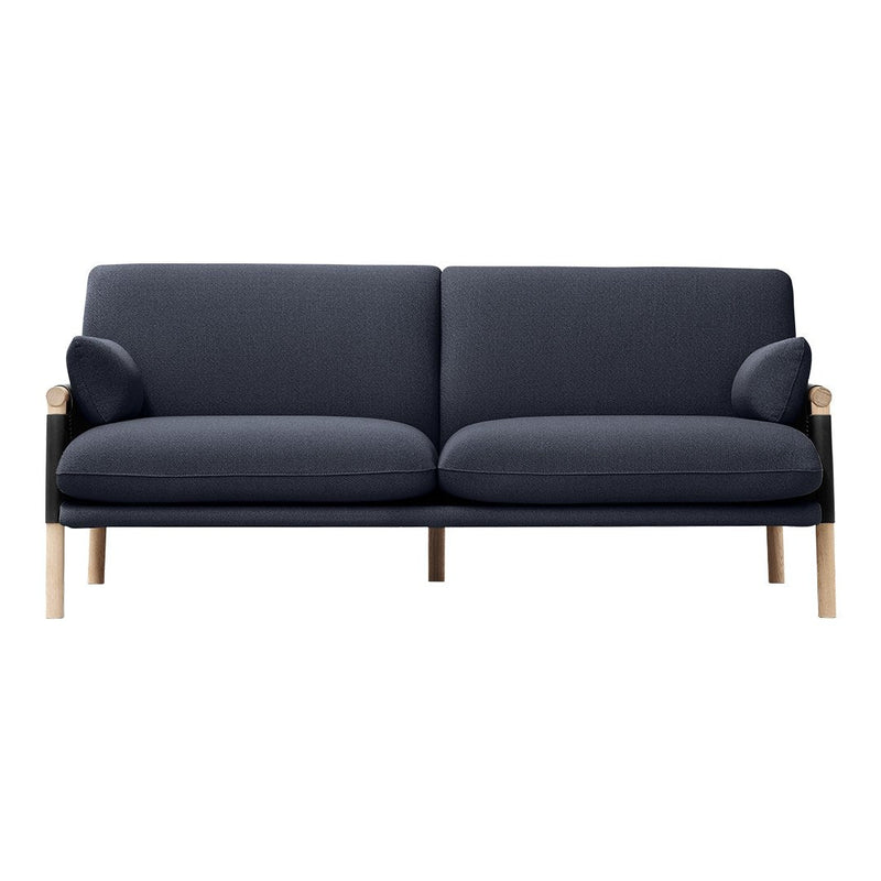 Dark blue two-seater sofa with curved arms and light wooden legs, showcasing a sleek, modern design.