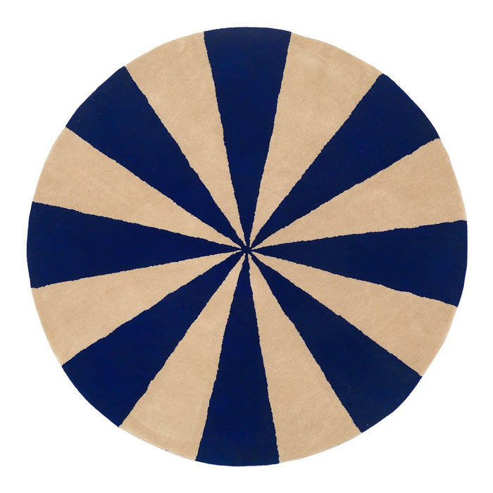 Round rug featuring alternating navy blue and beige stripes in a striking radial pattern. Perfect for modern decor.