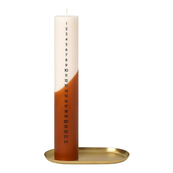 Tall white and brown gradient candle with numbered markings, paired with a sleek gold tray.