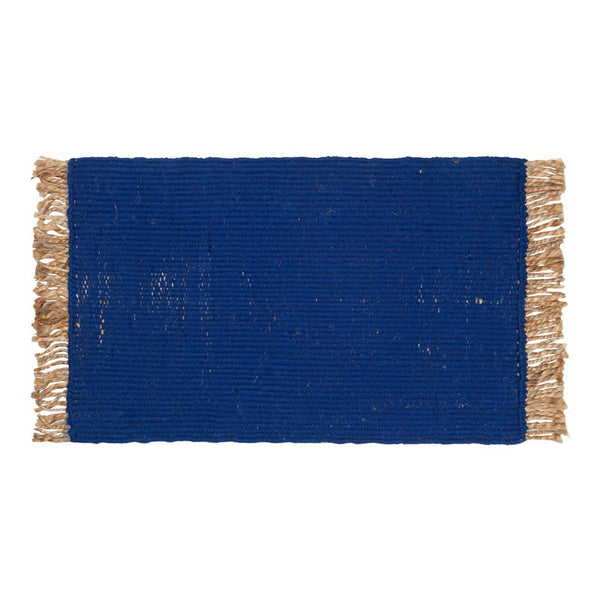 Bold blue rectangular rug with textured weave and tassel fringe. Ideal for adding color and style to any space.