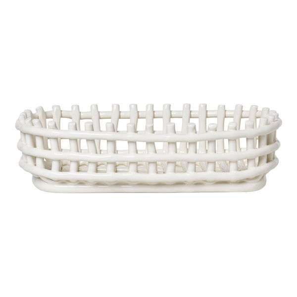 White woven basket with an oval shape and open lattice design, perfect for storage and decor.