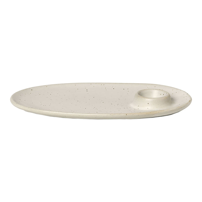 Beige oval plate with a speckled texture and a circular indent for candles or décor. Perfect for modern table settings.