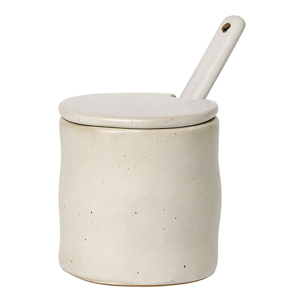 Cream ceramic jar with a smooth matte finish and white lid, featuring a minimalist design. Ideal for kitchen storage.