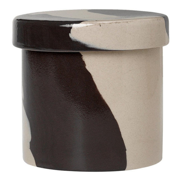 Ceramic storage jar in beige and black with abstract brushstroke pattern. Modern and stylish decor accent.