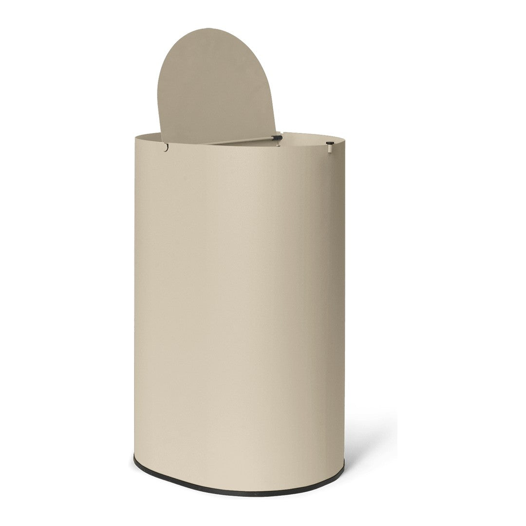 Beige cylindrical trash can with a rounded lid and a minimalist design. Smooth texture enhances modern decor.
