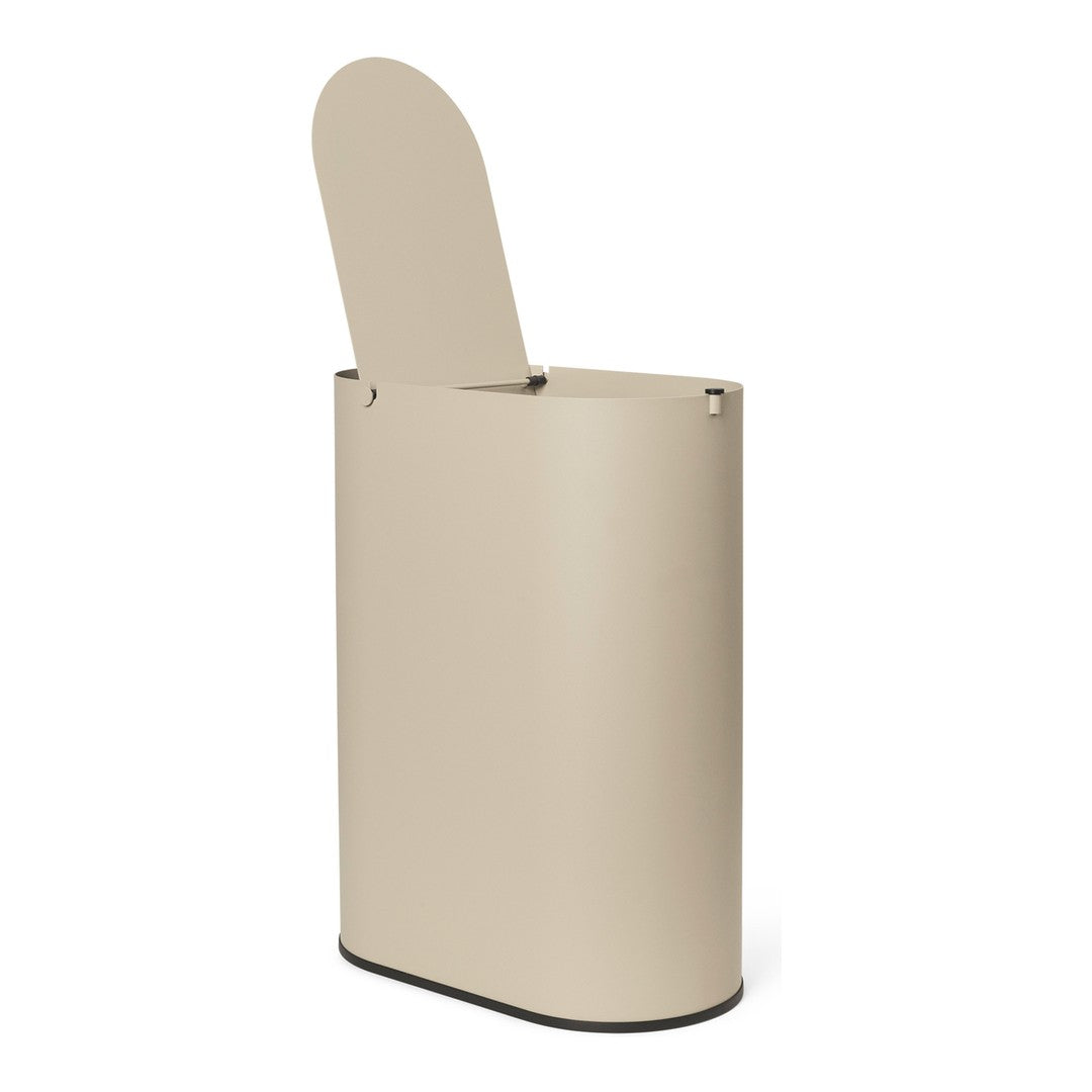 Beige cylindrical trash can with a lid and black base, featuring a smooth, modern design. Ideal for contemporary spaces.