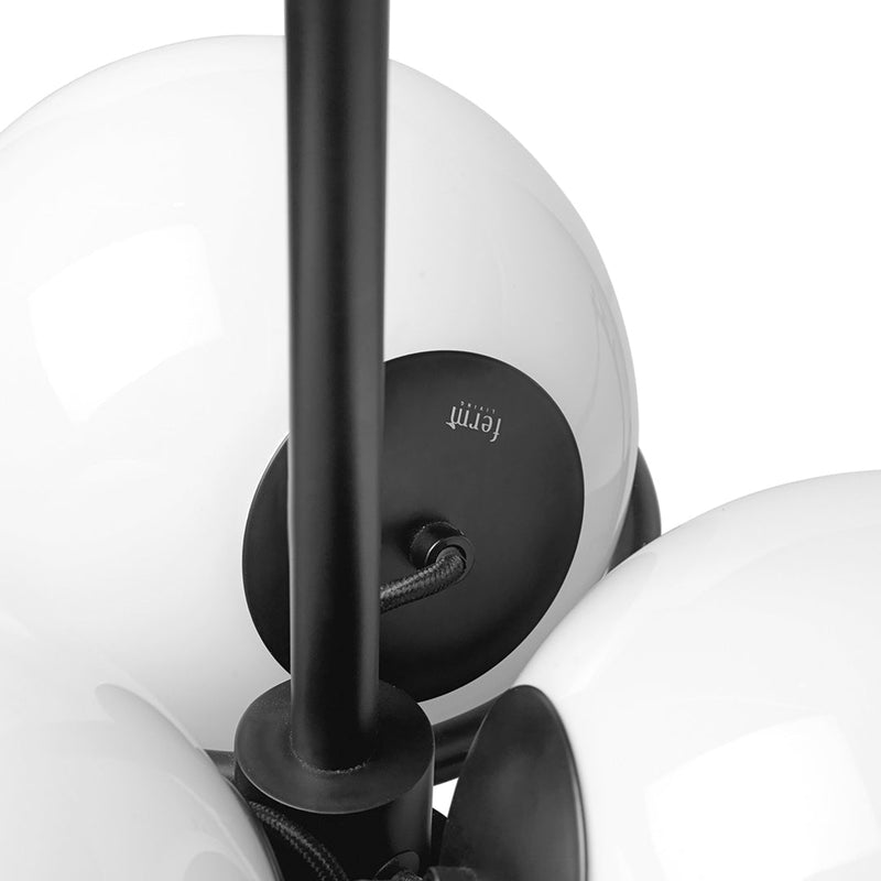 Black metal chandelier with glossy white glass globes, showcasing a minimalist design and modern style.