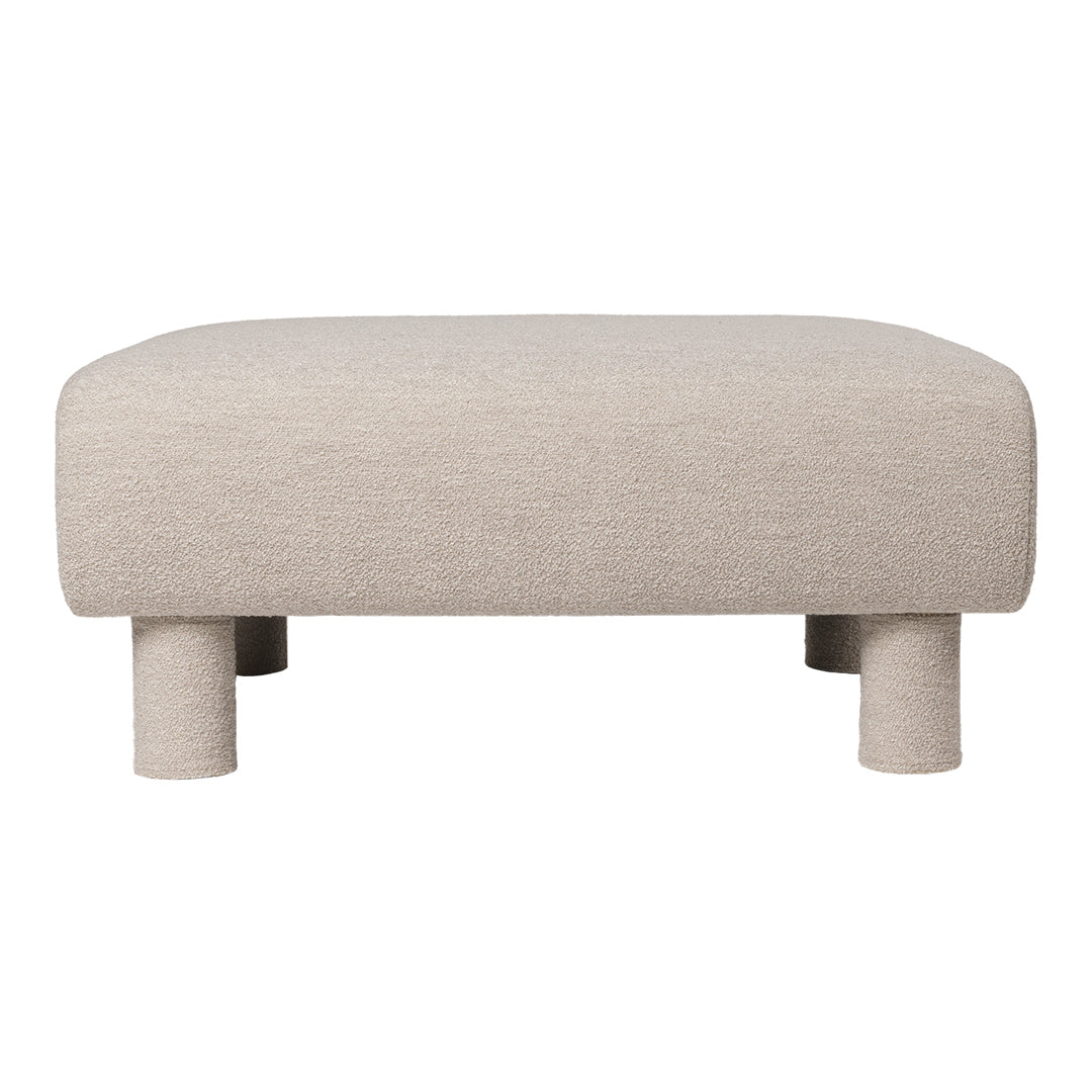 Beige fabric ottoman with a smooth, minimalist design and rounded edges, featuring four short, sturdy legs.