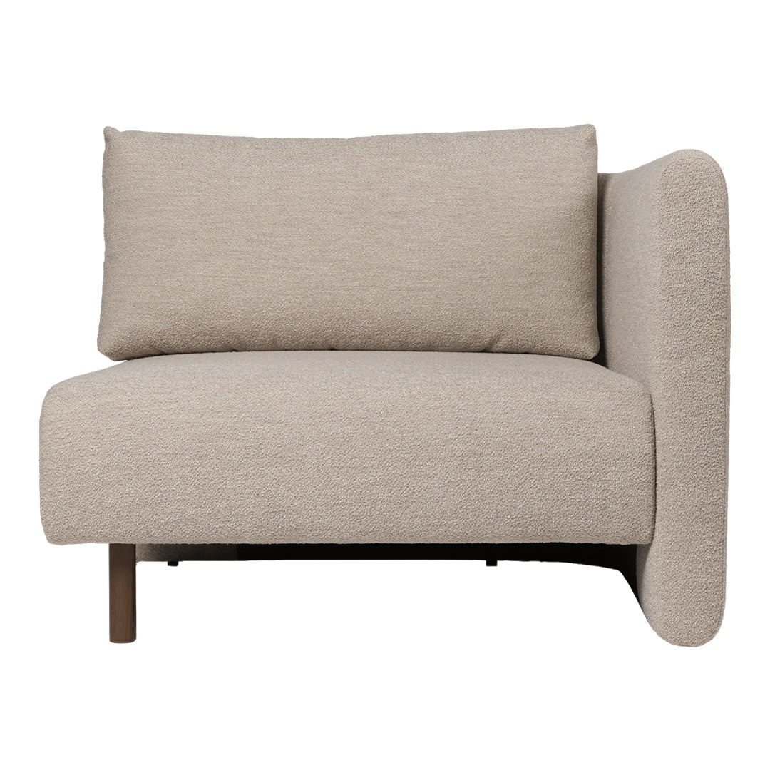 Light beige upholstered accent chair with a smooth texture and minimalist design.