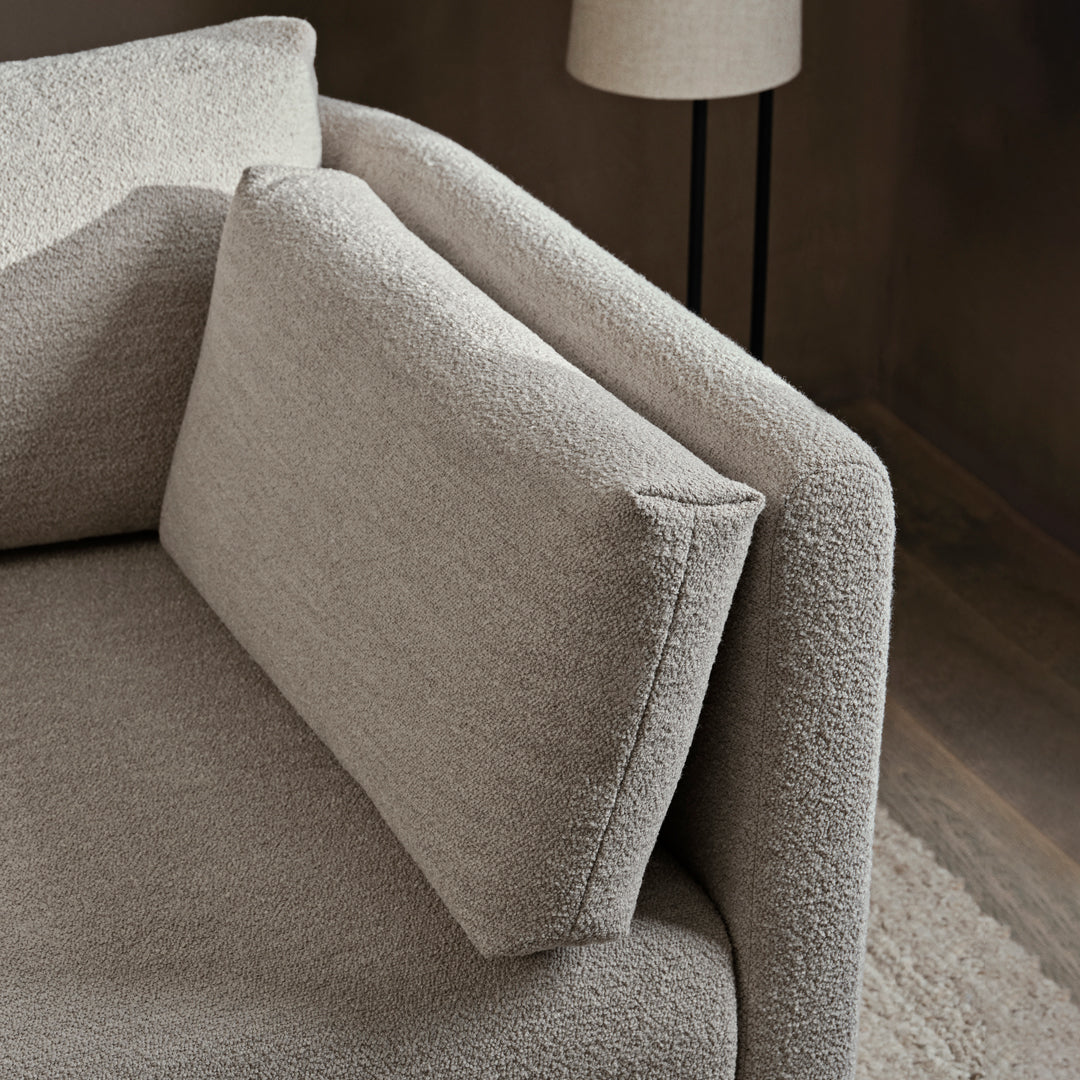 Textured light beige sofa with a minimalist design and matching rectangular cushion. Ideal for modern interiors.