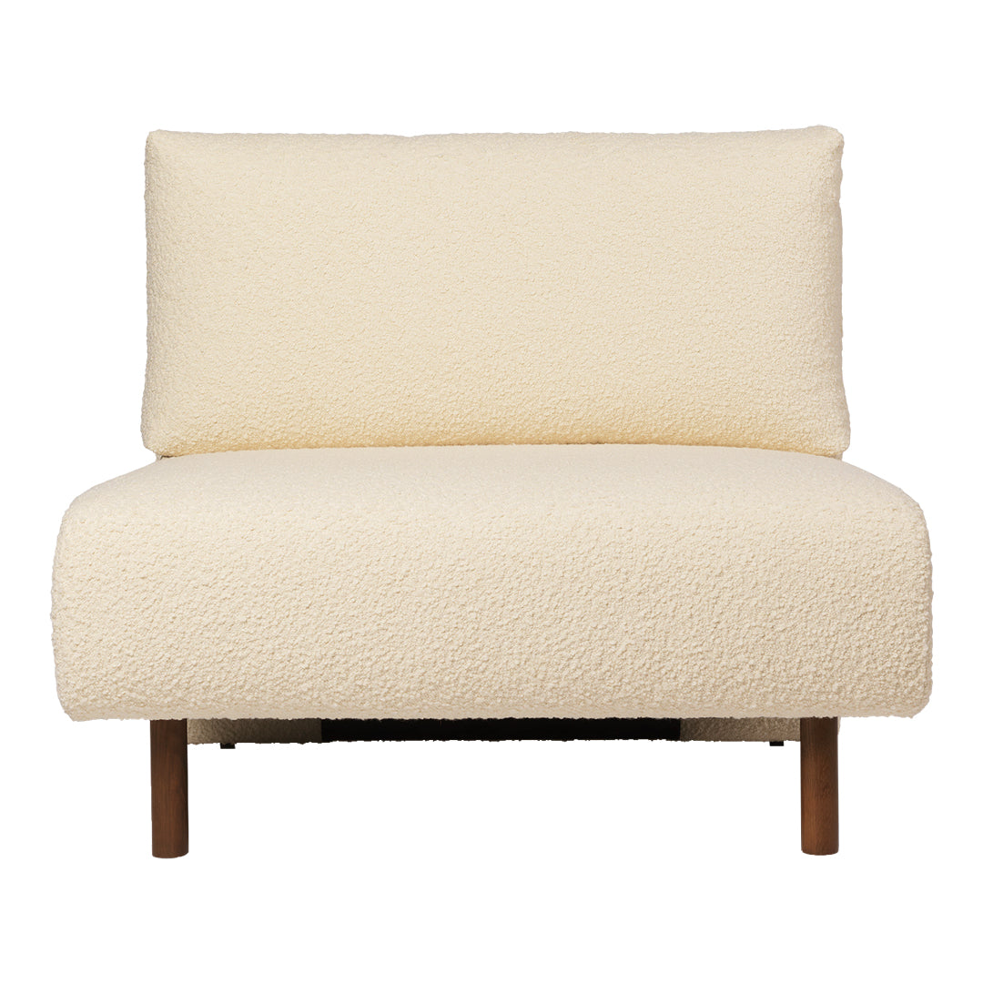 Cream textured chair with soft fabric and minimalistic design, featuring simple wooden legs and a modern aesthetic.