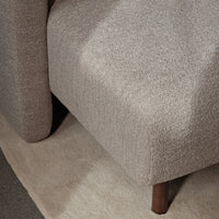 Soft beige textured fabric with a subtle pattern, complemented by warm wooden legs. Ideal for modern interiors.