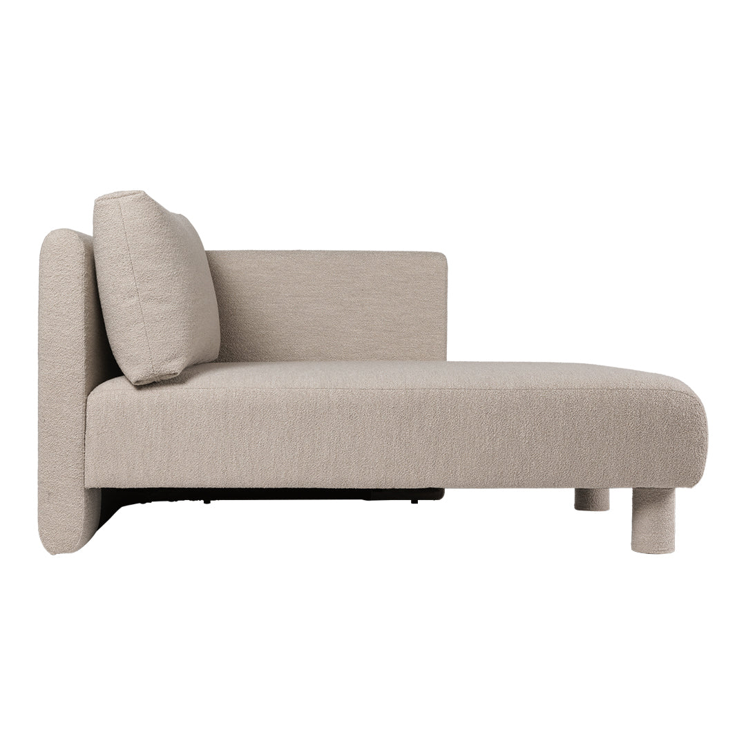 Beige chaise lounge with a minimalist design and textured fabric, featuring a smooth surface and soft cushion.