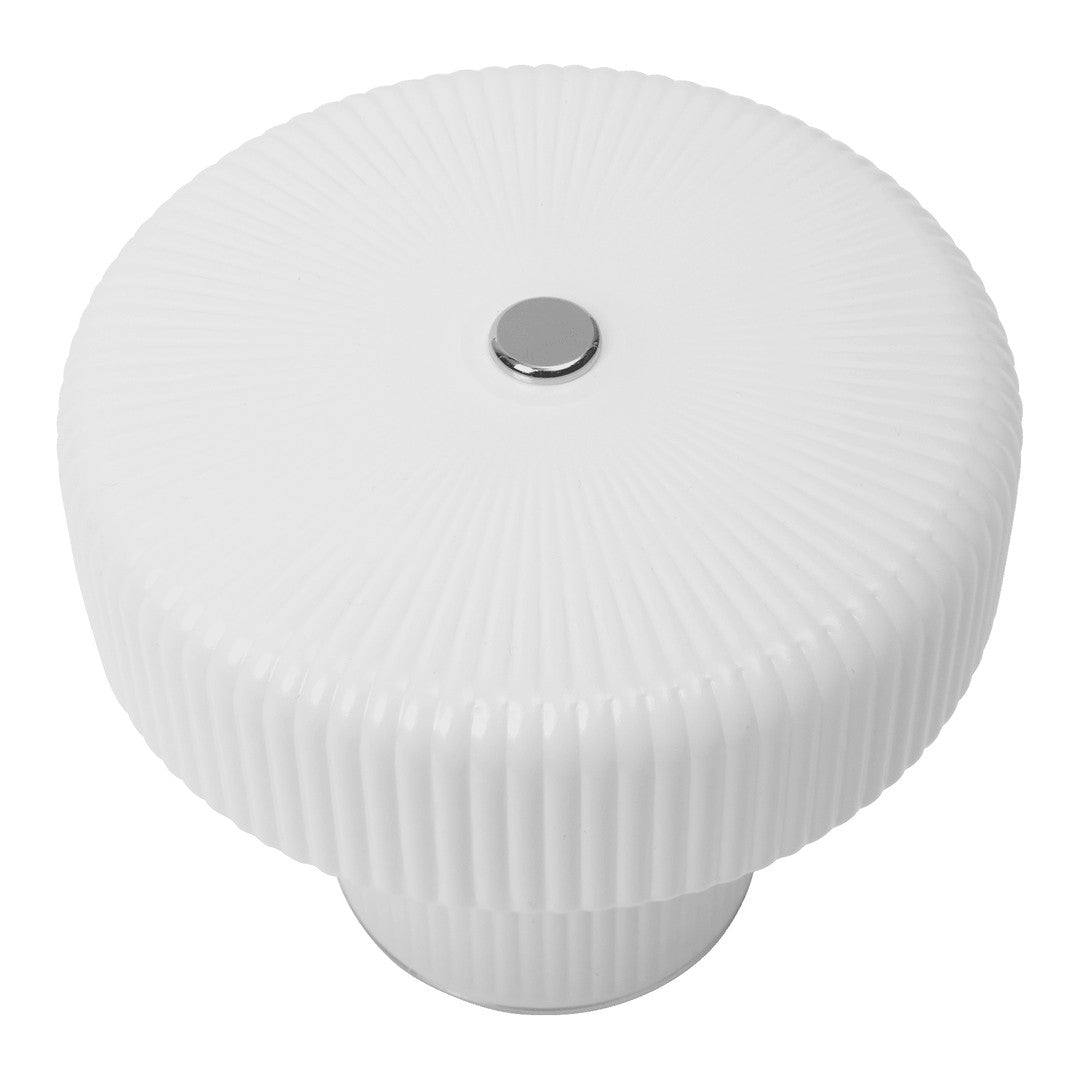 White ribbed cabinet knob with a shiny silver center, perfect for a modern or minimalist decor.
