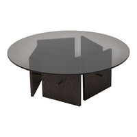 Round coffee table featuring a smoky glass top and dark wood geometric base. Sleek, modern design with elegant contrasts.