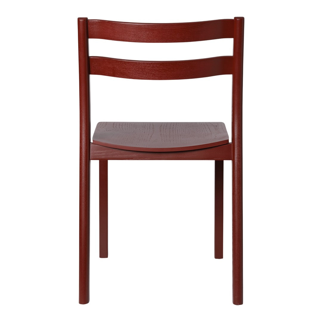 "Solid burgundy dining chair with sleek, minimalist design and smooth wood finish."