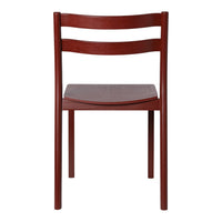"Solid burgundy dining chair with sleek, minimalist design and smooth wood finish."