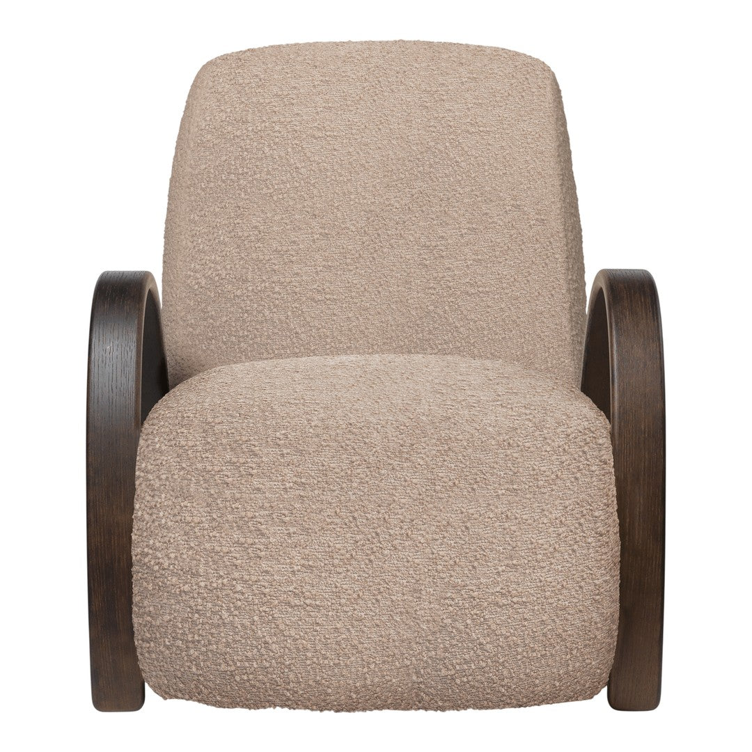 Beige, textured upholstery on a comfortable chair with dark wood armrests, offering a modern, cozy aesthetic.