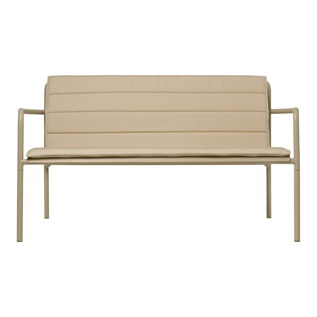 Beige upholstered loveseat with horizontal stitching and a light metal frame for modern decor.