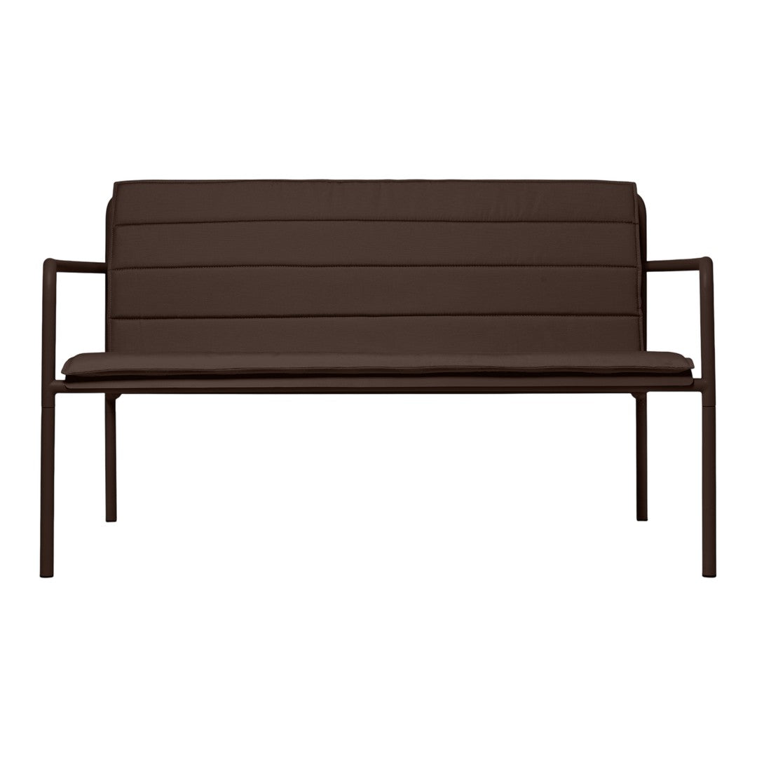 Brown padded bench with a sleek, modern design and horizontal ribbed pattern. Ideal for indoor or outdoor use.
