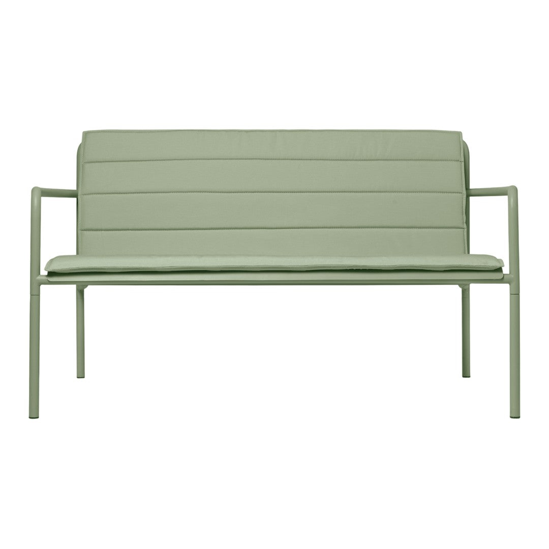 Light green modern bench with slatted back and smooth seat, perfect for outdoor or contemporary decor.