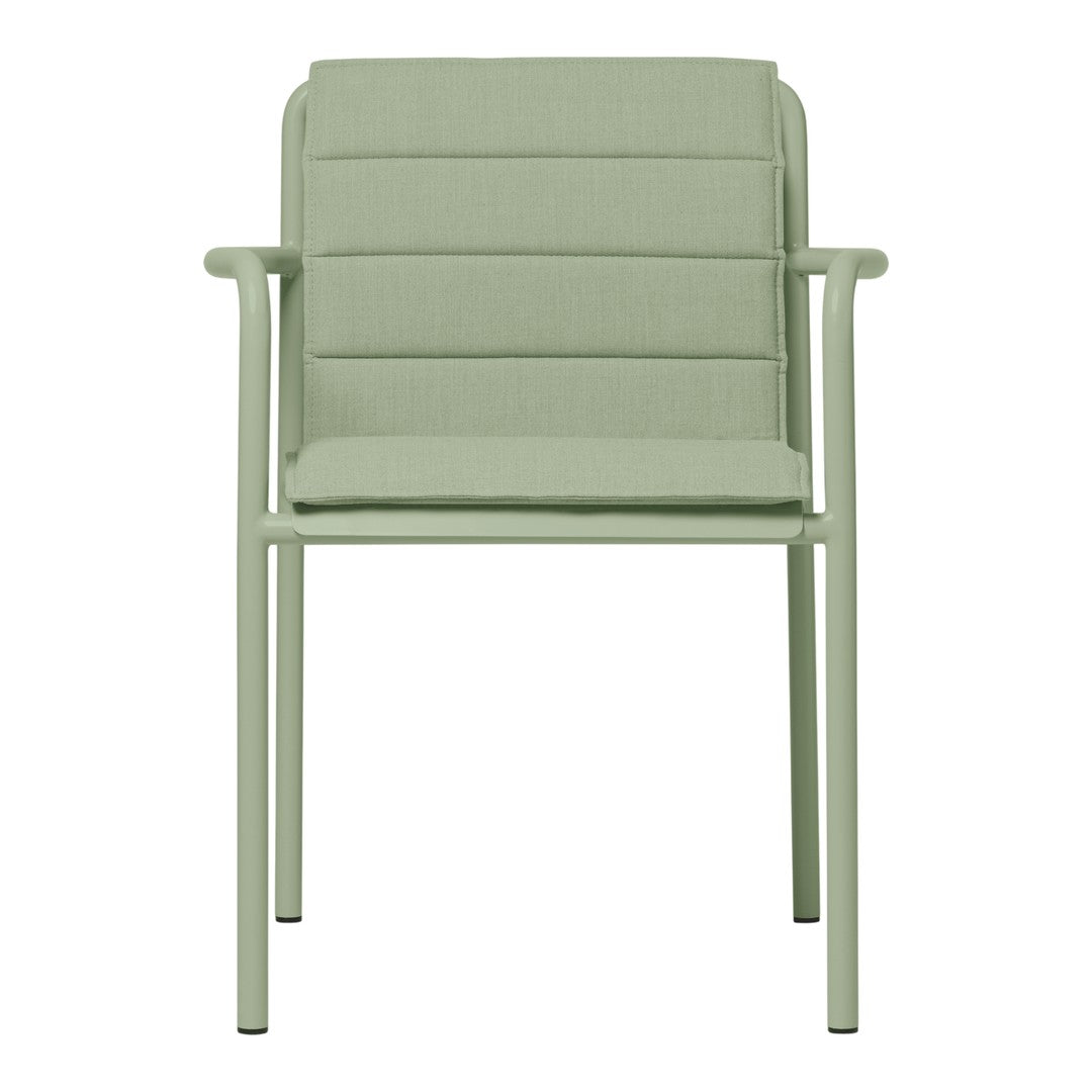Light green dining chair with a textured cushion and sleek metal frame. Modern design ideal for indoor or outdoor use.