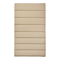 Beige padded mat with subtle quilted pattern and horizontal stitched lines for a sleek, modern look.