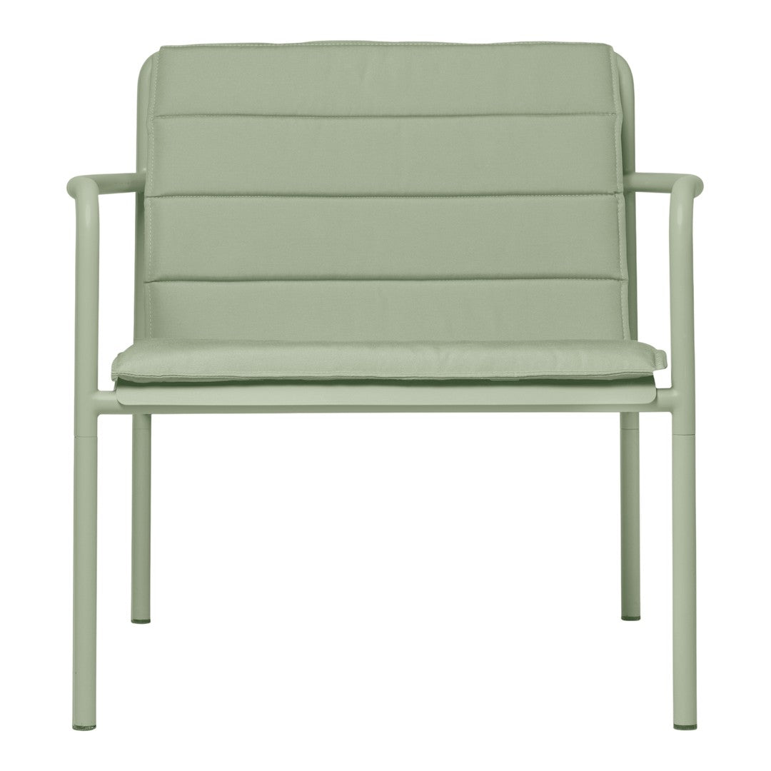 Light green modern armchair with horizontal quilted pattern and minimalistic metal frame. Ideal for contemporary decor.
