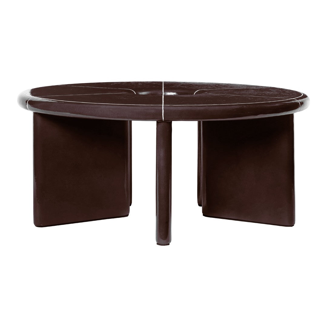 Round coffee table in deep brown with sleek, smooth finish and minimalist design featuring geometric cutouts.