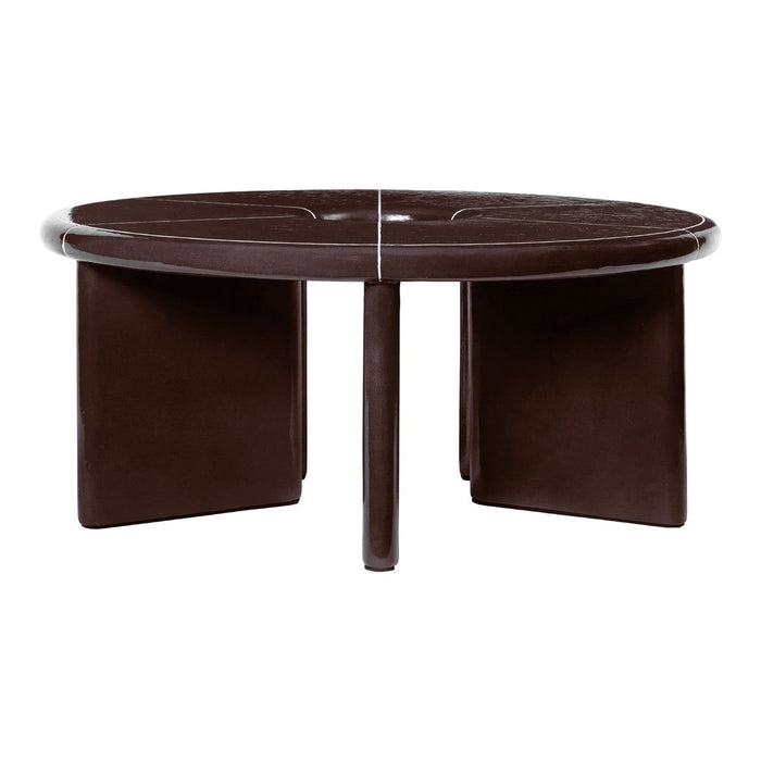 Round coffee table in deep brown with sleek, smooth finish and minimalist design featuring geometric cutouts.