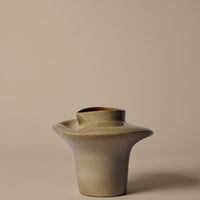 Beige ceramic vase with smooth, rounded shape and subtle matte finish. Simple and modern design perfect for decor.