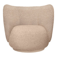 Beige textured armchair with soft, cozy fabric and curved, inviting silhouette. Perfect for modern interiors.