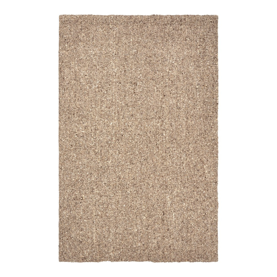 Neutral beige textured area rug with a subtle, natural pattern, perfect for enhancing cozy spaces.