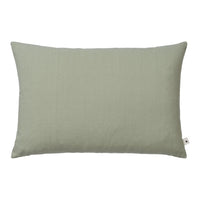 Solid sage green pillow with a smooth texture, perfect for adding a touch of elegance to any decor.
