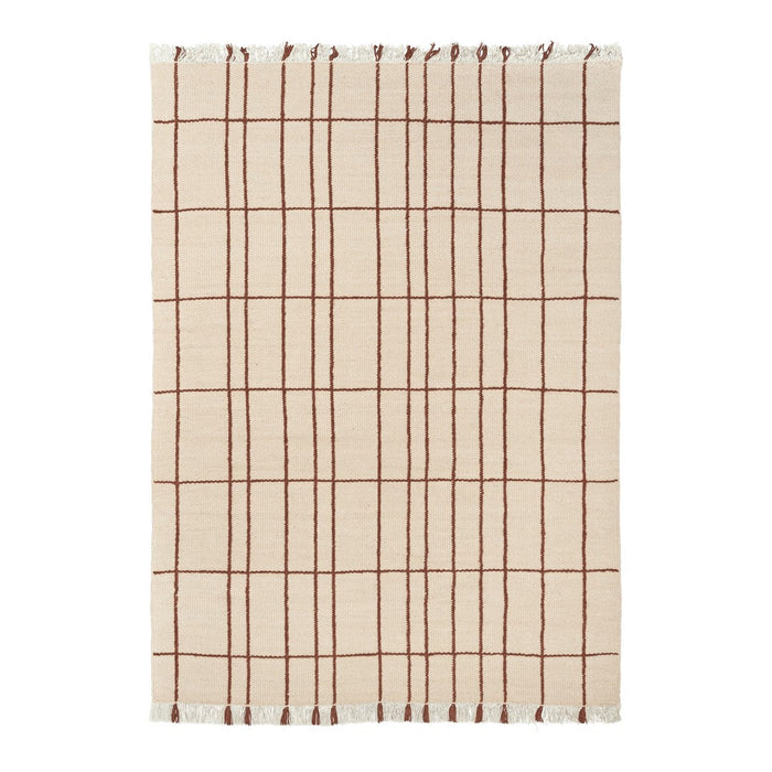 Beige cotton blanket with a brown grid pattern and fringed edges. Perfect for adding texture to any space.