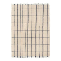 Beige plaid rug with navy grid pattern, ideal for modern decor. Soft texture and stylish design enhance any space.