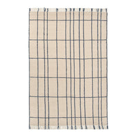 Beige rug with a grid pattern featuring navy blue lines, adding a modern touch to any space. Perfect for versatile decor.