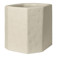 Light beige ceramic planter with a textured, matte finish and geometric shape. Ideal for modern decor.