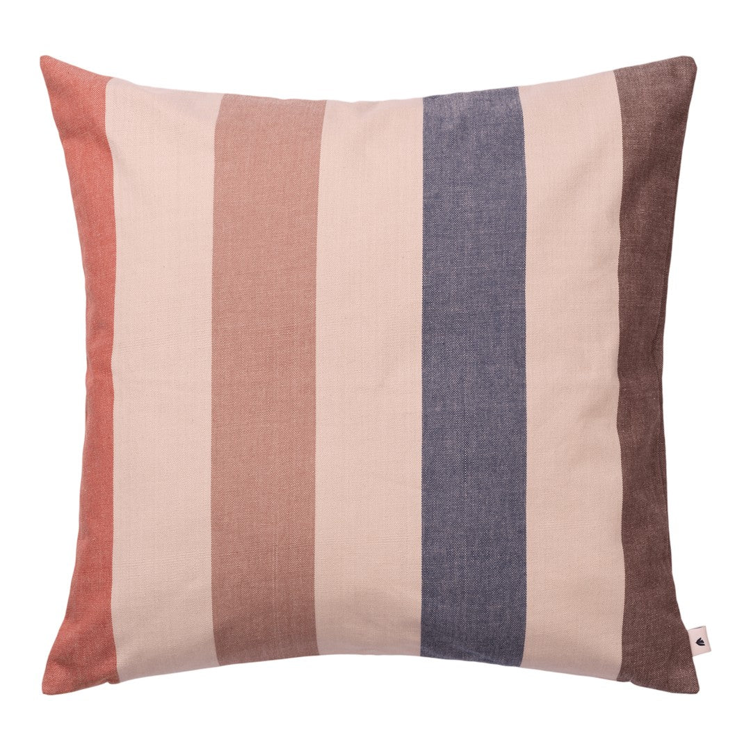 Striped pillow in soft shades of peach, cream, navy, and brown, adding a cozy touch to any decor.