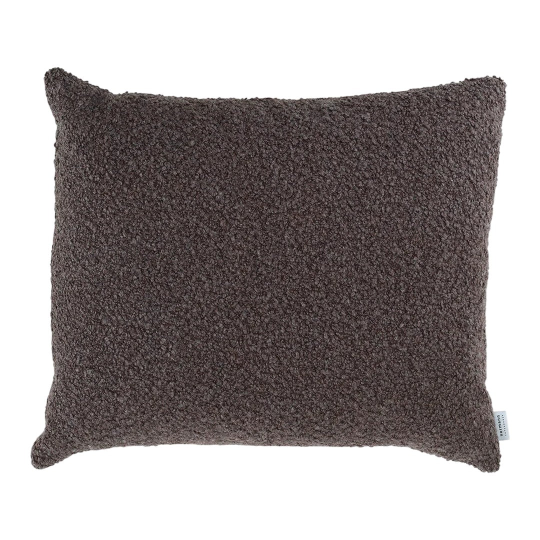 Textured dark brown throw pillow with a soft, cozy surface, perfect for adding warmth to any decor.