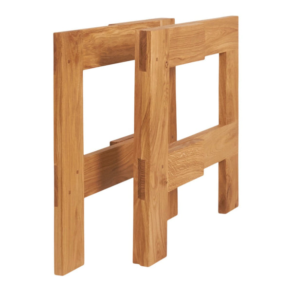 Natural oak wood folding table base with a smooth finish and minimalistic design. Warm golden tones and clean lines.