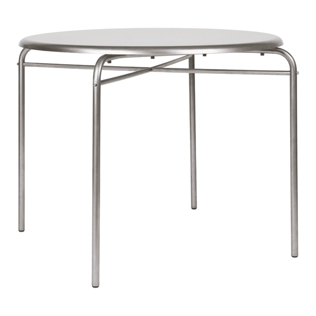 Round white tabletop with sleek silver metal legs, featuring a minimalist, modern design.