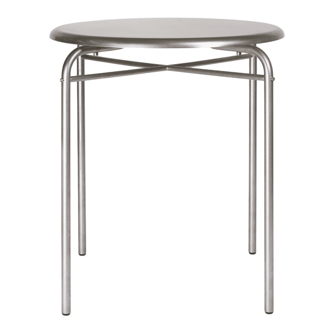 Silver round table with a minimalist design and crisscross metal legs, perfect for modern interiors.